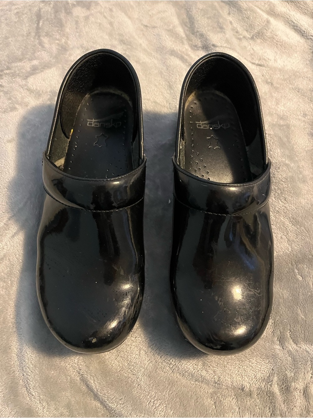 Dansko Women’s Black Patent Clogs